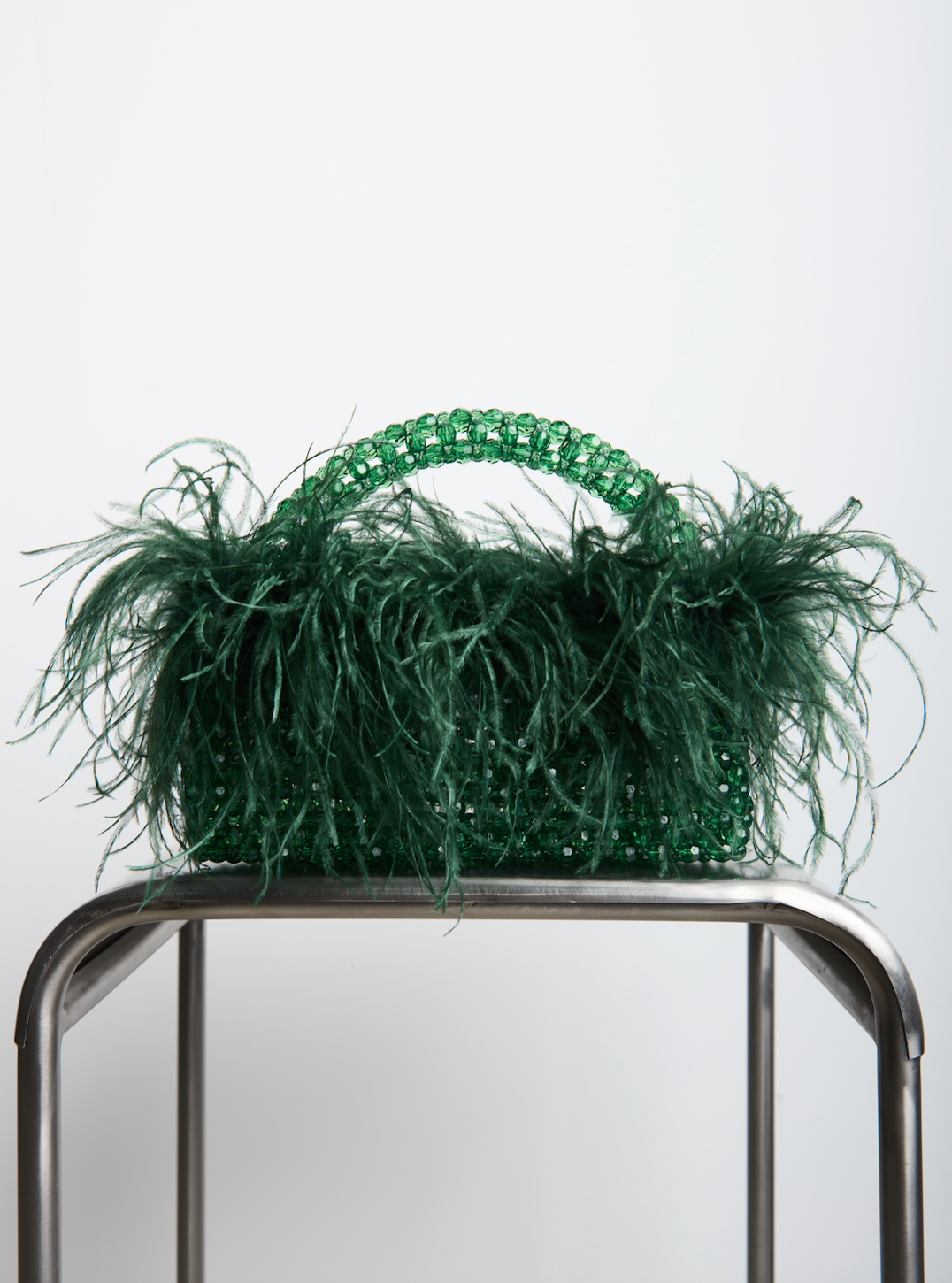FEATHER TOP HANDLE in dark green beaded crystals